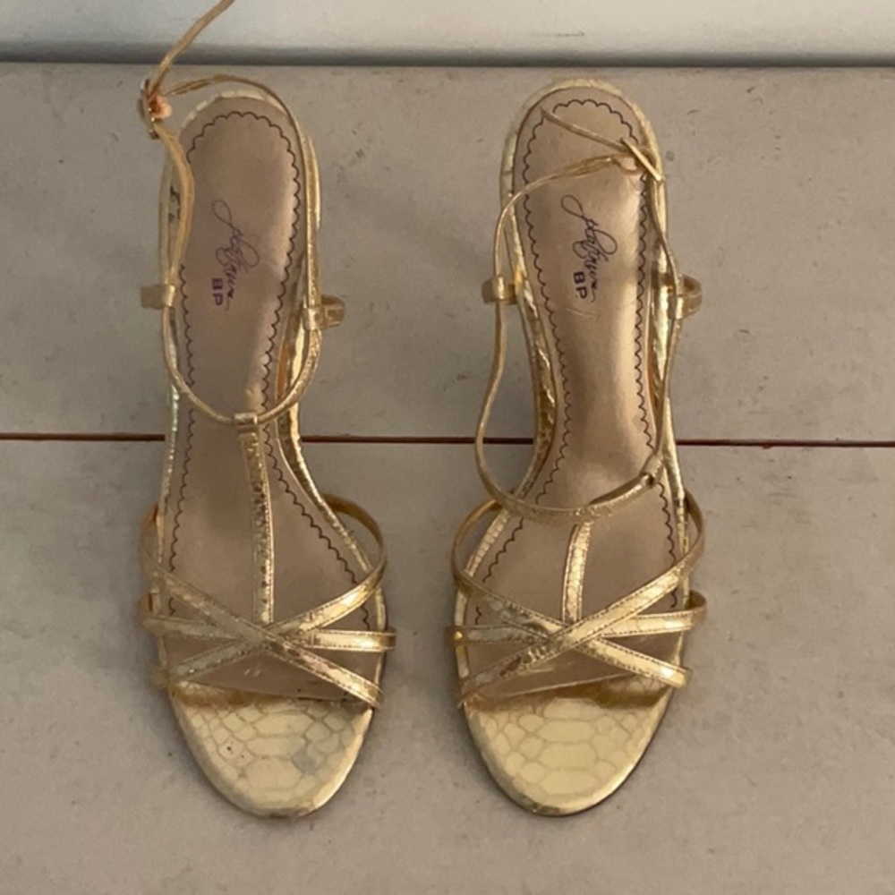 Gold strappy heals.